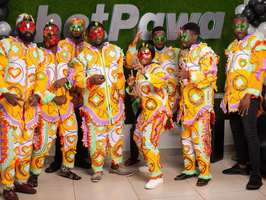 pawaTech team celebrating in vibrant traditional costumes